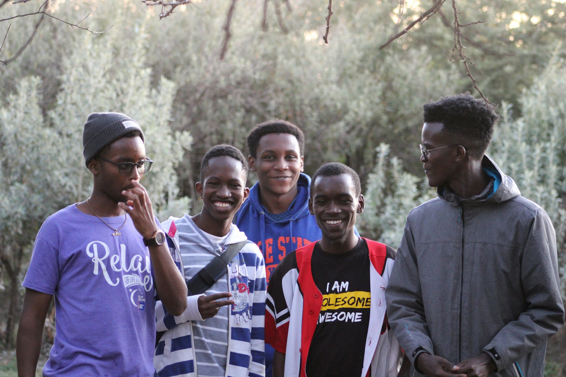a group of young men standing next to each other